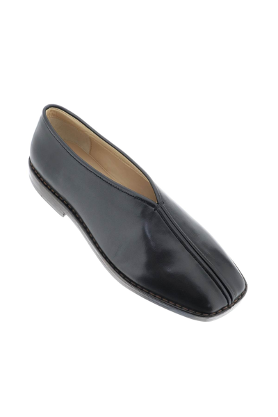 Shop Lemaire Shiny Nappa Leather Slip-ons In Black (black)