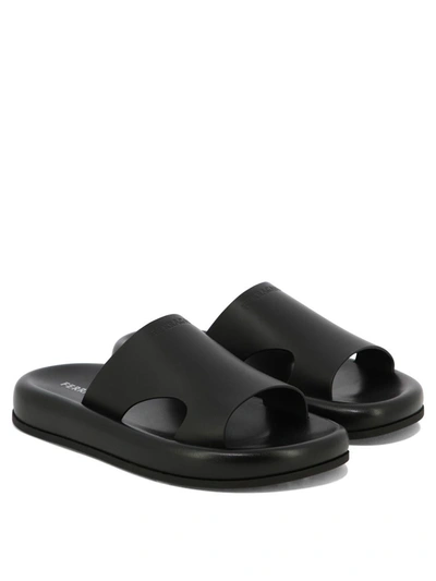 Ferragamo Logo-embossed Leather Slides In Black
