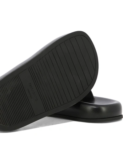 Ferragamo Logo-embossed Leather Slides In Black