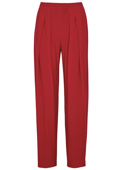 Shop Norma Kamali Tapered Stretch-jersey Trousers In Red