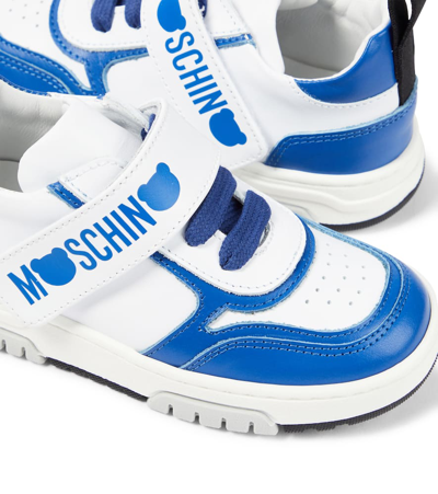 Shop Moschino Logo Leather Sneakers In White