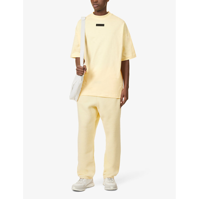 Shop Essentials Fear Of God  Men's Garden Yellow  Brand-embossed Cotton-jersey T-shirt