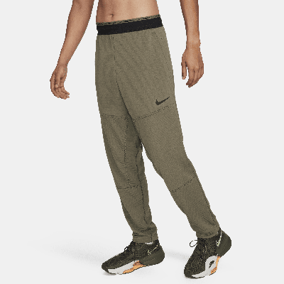 Shop Nike Men's Dri-fit Fleece Fitness Pants In Green