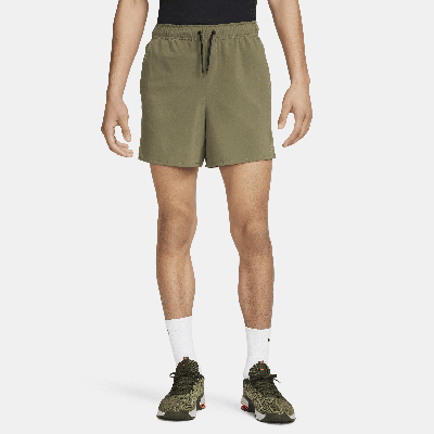 Shop Nike Men's Unlimited Dri-fit 5" Unlined Versatile Shorts In Green