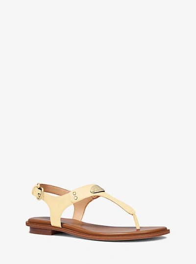 Shop Michael Kors Logo Plate Leather Sandal In Yellow