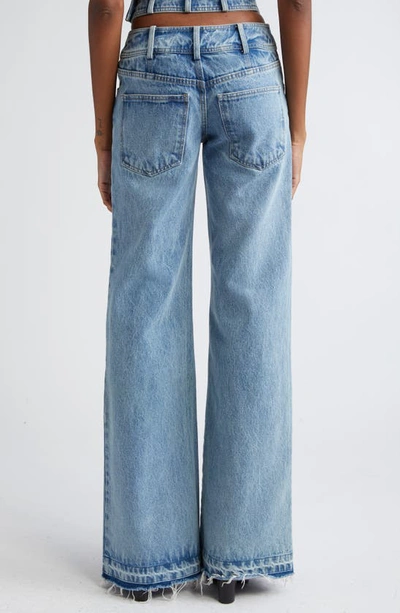 Shop Monse Crisscross Waist Raw Hem Wide Leg Jeans In Indigo