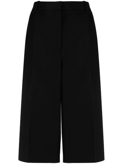 Shop Versace Women Informal Wool Pants In 1b000 Black