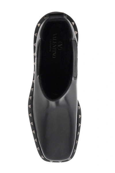 Shop Valentino Garavani Rockstud M-way Ankle Boots Men In Black