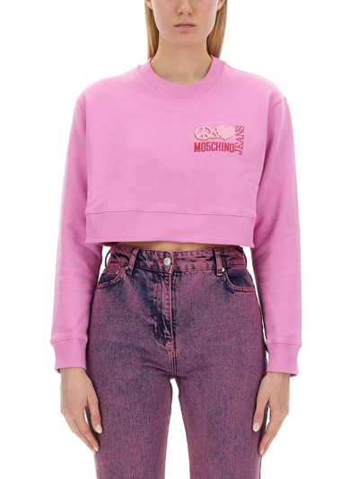Shop Moschino Logo Printed Crewneck Cropped Sweatshirt In Pink
