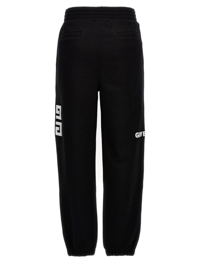 Shop Givenchy Flocked Logo Joggers In Black