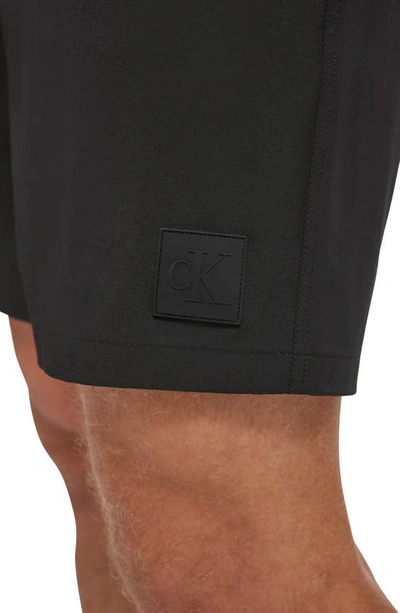 Shop Calvin Klein Repreve® Stretch Hybrid Volley Swim Trunks In Black