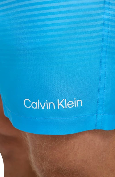 Shop Calvin Klein Core Volley Gradient Stripe Swim Trunks In Light Blue