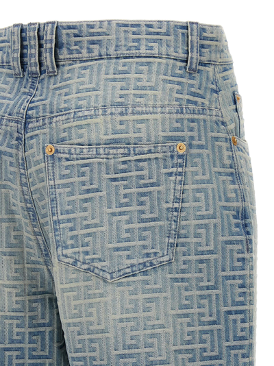 Shop Balmain Monogram Jeans In Light Blue