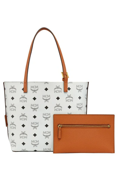 Shop Mcm Mini Lauretos Reversible Leather Shopper Bag In Cognac