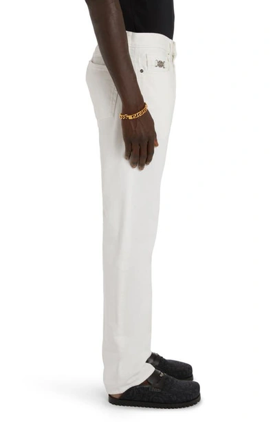 Shop Versace Medusa Buckle Straight Leg Jeans In White
