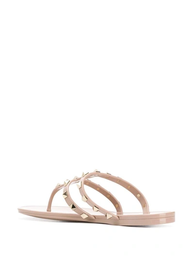 Shop Valentino Garavani Rockstud Rubber Thong Sandals In Powder