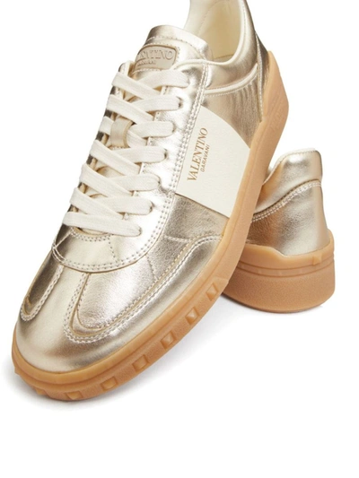 Shop Valentino Garavani Upvillage Leather Sneakers In Golden