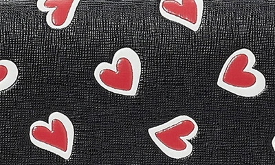 Shop Kate Spade Morgan Stencil Hearts Embossed Continental Wallet In Black Multi.