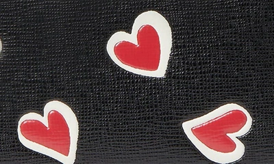 Shop Kate Spade Morgan Stencil Hearts Embossed Wallet In Black Multi.