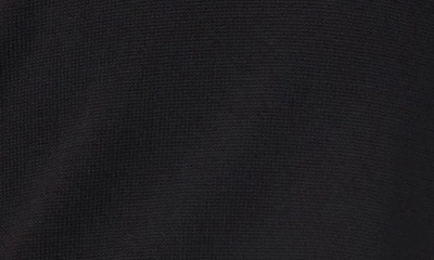 Shop Cece Cotton Blend Polo Sweater In Rich Black