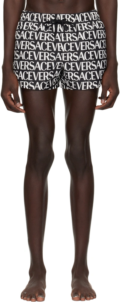 Shop Versace Black Allover Swim Shorts In 5b040-black+white