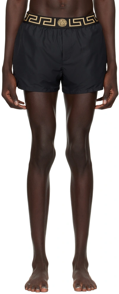 Shop Versace Black Greca Border Swim Shorts In A80g-black Gold Gree