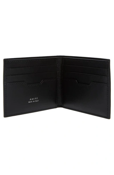 Shop Amiri Staggered Logo Leather Bifold Wallet In Black