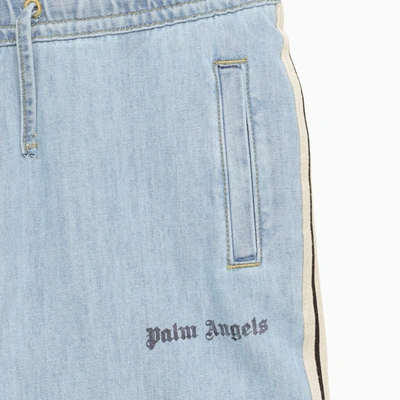Shop Palm Angels Light Blue Denim Jeans With Logo