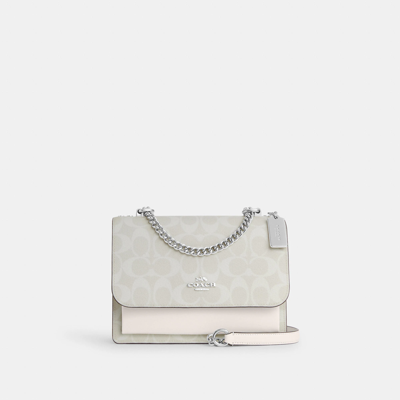 Shop Coach Outlet Klare Crossbody In Signature Canvas In White