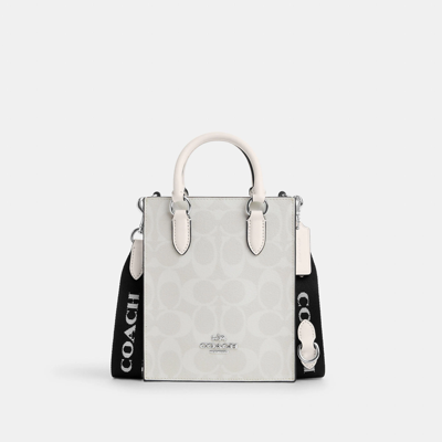 Shop Coach Outlet North South Mini Tote In Signature Canvas In White