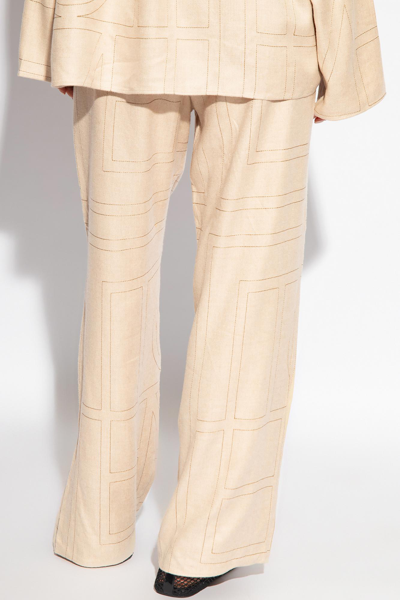 Shop Totême Toteme Trousers With Monogram In Neutro
