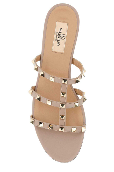 Shop Valentino Rockstud Slip-on Sandals In Cipria