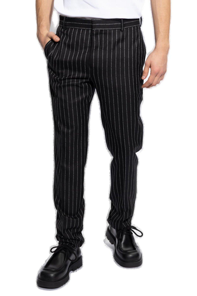 Shop Alexander Mcqueen Pinstriped Peat Front Trousers In Nero