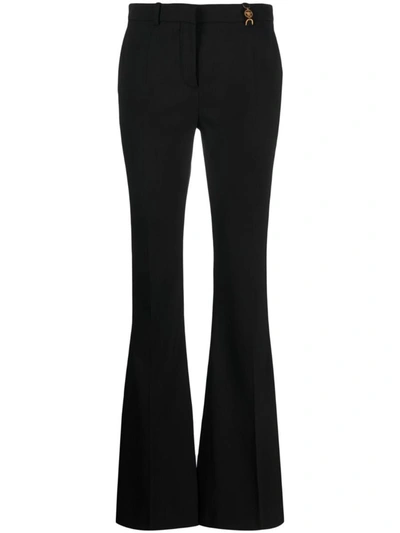 Shop Versace Flared Wool Trousers In Black