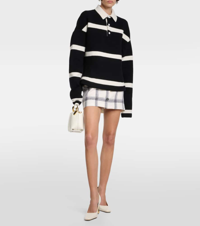 Shop Jw Anderson Striped Wool-blend Polo Sweater In Black