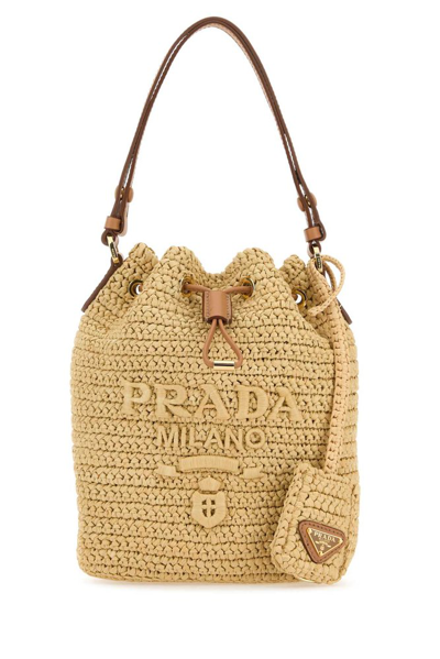 Shop Prada Drawstring Crochet Mini Bucket Bag In Beige