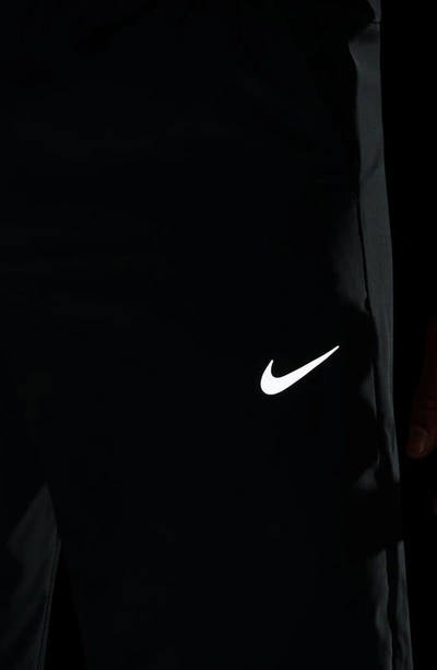 Shop Nike Form Dri-fit Versatile Pants In Smoke Grey/ Black/ Silver