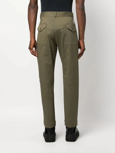Shop Moncler Logo Patch Tapered Trousers In Green