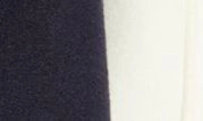 Renowned Embroidered Varsity Jacket In Creme