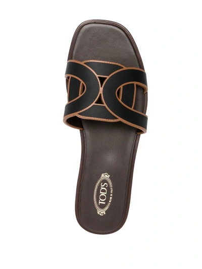 Shop Tod's Leather Flat Sandals In Black