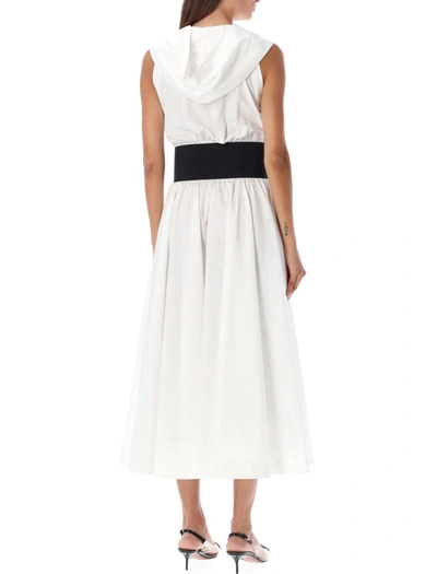 Shop Alaïa Belted Hooded Dress In White/black