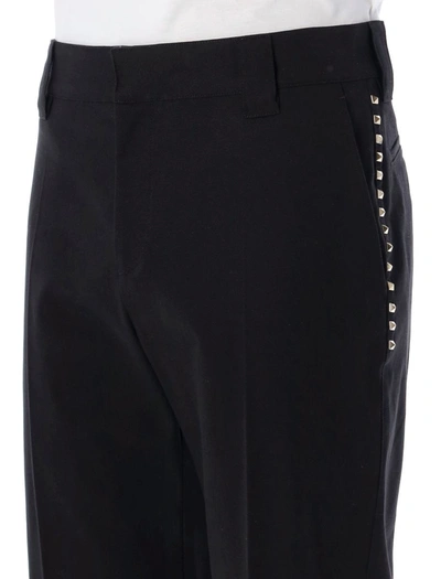 Shop Valentino Garavani Pants With Studs In Black