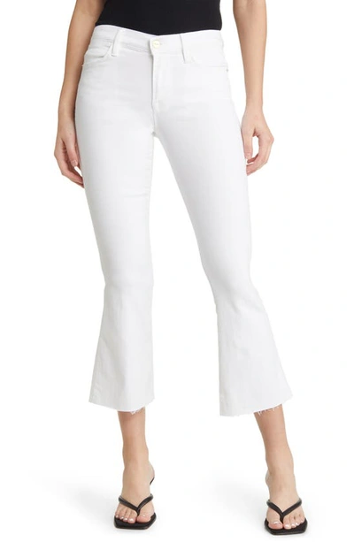 Shop Frame Le Crop Flare Raw Hem Jeans In Blnc