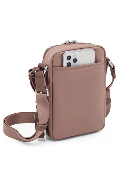 Shop Tumi Persia Crossbody Bag In Light Mauve