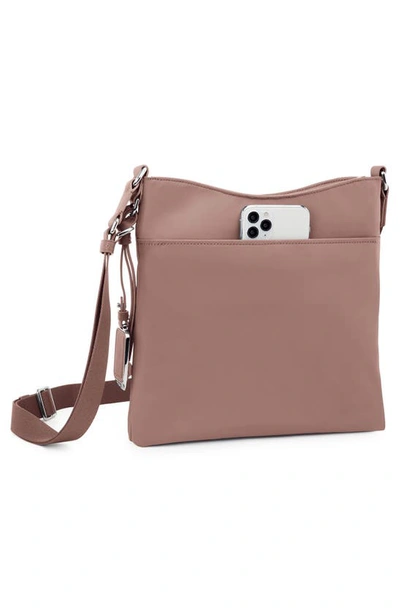 Shop Tumi Tyler Crossbody Bag In Light Mauve