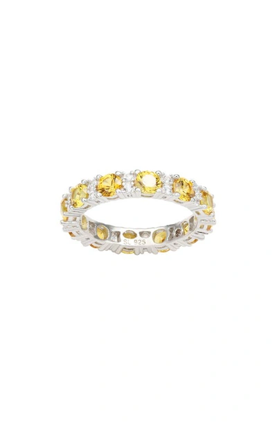 Suzy Levian Sterling Silver Round Cut Yellow Sapphire And Diamond Accent Eternity Band In Yellow