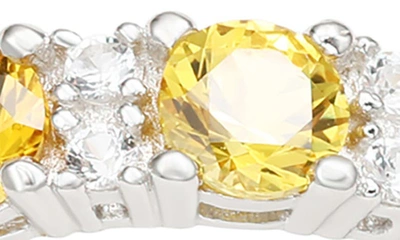 Suzy Levian Sterling Silver Round Cut Yellow Sapphire And Diamond Accent Eternity Band In Yellow