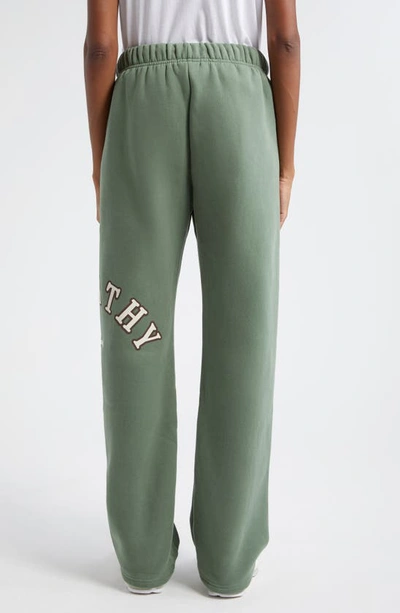 Shop The Mayfair Group Gender Inclusive Empathy Wide Leg Fleece Sweatpants In Army Green