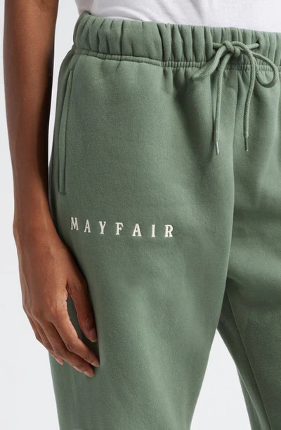 Shop The Mayfair Group Gender Inclusive Empathy Wide Leg Fleece Sweatpants In Army Green