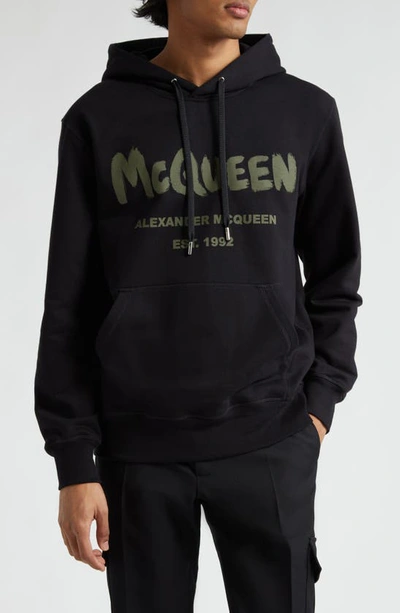 Shop Alexander Mcqueen Graffiti Logo Cotton Graphic Hoodie In Black/ Khaki